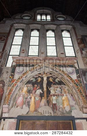 Italy, Verona - December 08 2017: The View Of Windows And The Crucifix By Turone Di Maxio In Upper C