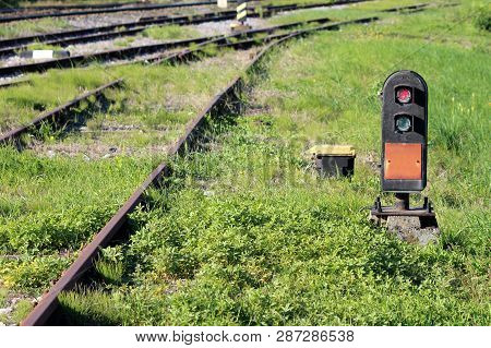 Red Light On Railway Trackside Traffic Signal Light Mounted On Steel Plate And Concrete Foundation N