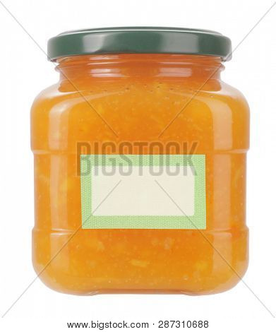 Homemade orange jam or marmalade in glass jar with blanco label