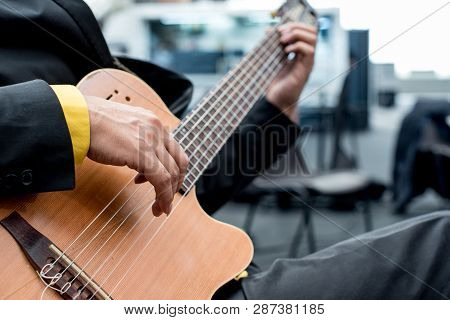 Details Of Hands Of A Musician Playing Acustic Guitar, Guitarist Without Plectrum, Fingers With Long