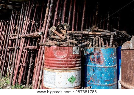 Scaffolding Storage Area In Outdoor, Detail Of Stacks Of Pipes, Poles, Used And Rusty Staffolding