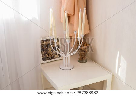 Interior And Decor Concept - Vintage Candlestick In The Bedroom