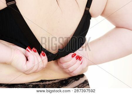 Fat Woman Rear View Opening Taking Off Or Putting On Her Bra. Plus Size Overweight Female Model Wear