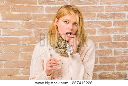 Take Medications To Reduce Fever. Woman Tousled Hair Scarf Hold Glass Water And Tablets Blister. Wha