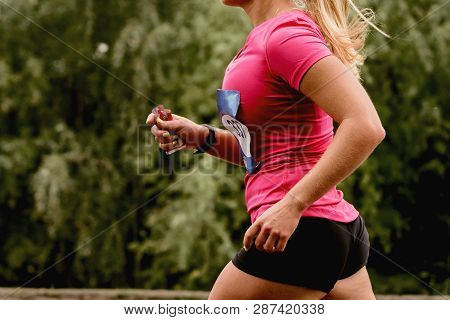 Young Woman In Pink T-shirt Running On Green Trees Background