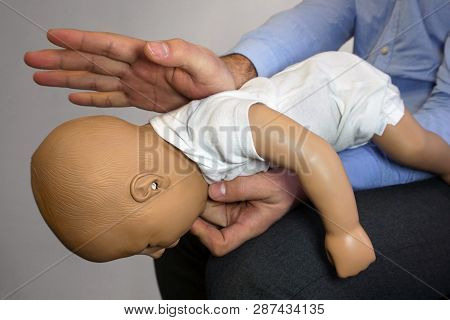 Back Blows (the Heimlich Maneuver Or Heimlich Manoeuvre) On A Simulation Mannequin Infant Dummy Duri