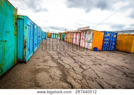 Multicolored Garages In The Industrial Area Witn Asphalt Road