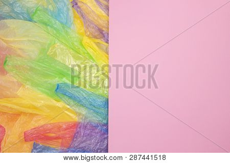 Multicolored Single Use Plastic Shopping Bags With Blank Pink Background For Text Or Image