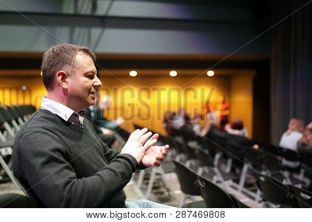 Happy Man Applauds In Theater