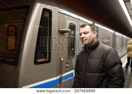 Man Standing On Subway Platform
