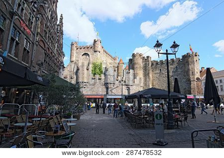 Ghent, Belgium- May 03, 2018: Square With Open Air Cafes. Ancient Castle Of The Counts (dutch: Grave