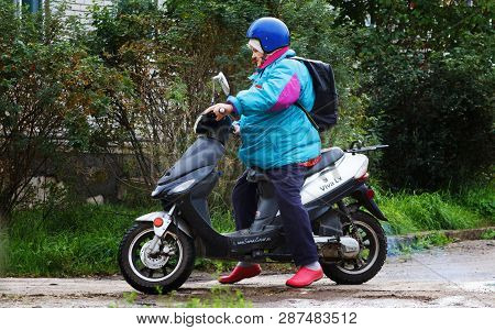 November, 2018 Russia St. Petersburg, Nazia Village, Grandmother On A Moped