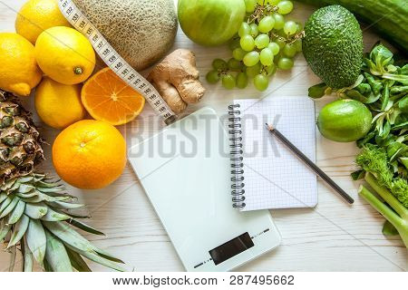 Flat Lay Composition With Kitchen Scales, Healthy Vegetables And Fruit On Wooden Background. Weight 