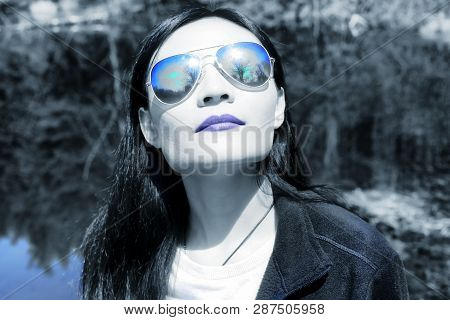 A Chinese Woman Looking Up Within Topsmead State Forest In Litchfield Connecticut On A Spring Day Wi