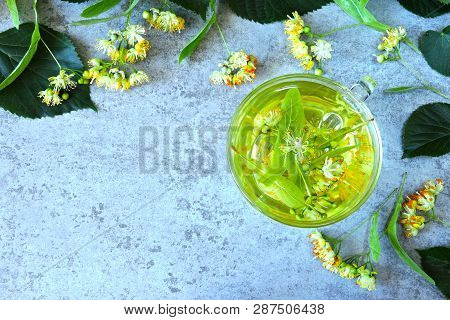 Linden And Linden Tea. Herbal Tea Made From Linden. Detox Herbal Tea. Herbal Tea In A Glass Cup.