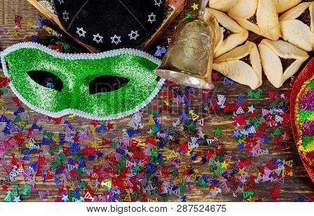 Purim Jewish Holiday With Purim Mask And Purim A Noisemaker On A Vintage Wood Background With Kosher