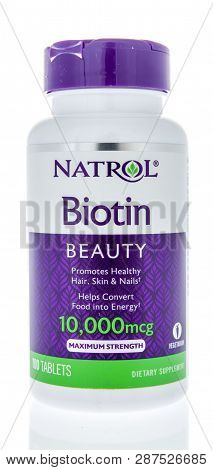 Winneconne, Wi - 21 February 2019: A Bottle Of  Natrol Biotin Supplement On An Isolated Background