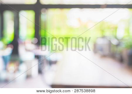 Blur Background Of Modern Ktichen With Countertop Near Window At Garden