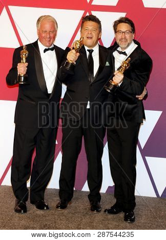 Paul Massey, Tim Cavagin and John Casali at the 91st Annual Academy Awards - Press Room held at the Loews Hotel in Hollywood, USA on February 24, 2019.
