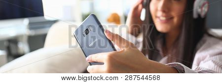 Minsk, Belarus - February 16, 2019 : Woman Holding Smartphone Samsung Galaxy S8 In Hand Illustrative