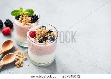 Berry Yogurt With Fresh Berries And Granola In Jar. Greek Yogurt, Healthy Breakfast Parfait In Glass