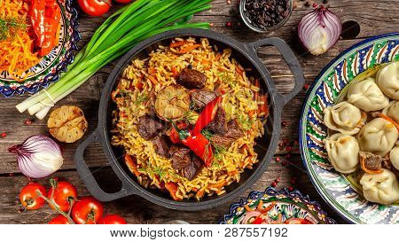 Traditional Uzbek Oriental Cuisine. Uzbek Family Table From Different Dishes In National Dishes For