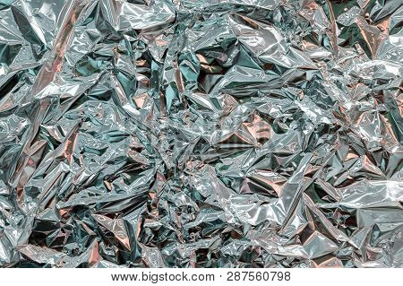 Holographic Texture Wrinkled Metal Foil. Hologram Abstract 80S Style Background With Blue, Purple An