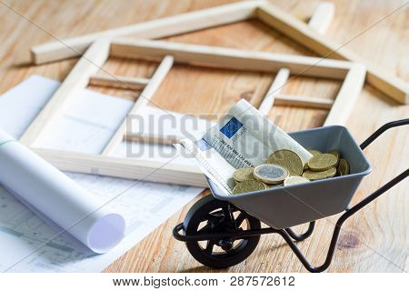 House With Puzzles And Planning Expenses For Building A House Abstract Concept
