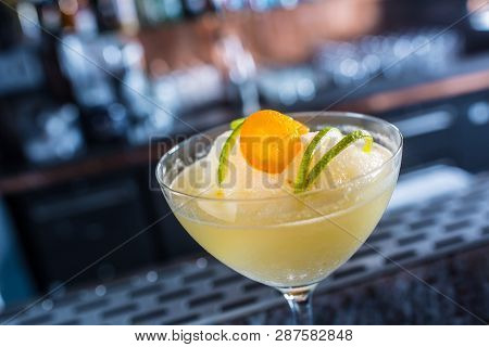 Cocktail Drink Frozen Margarita At Barcounter In Night Club Or Restaurant.