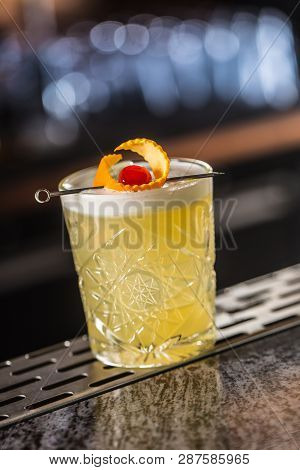 Cocktail Drink Whiskey Sour At Barcounter In Night Club Or Restaurant.