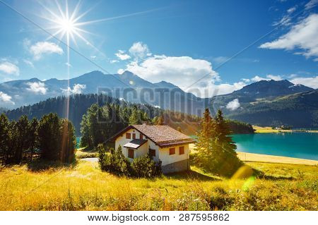 Awesome alpine lake Champfer in beautiful summer day. Location place Silvaplana village, Swiss alps, district of Maloja, Europe. Scenic image of famous european resort. Discover the beauty of earth.
