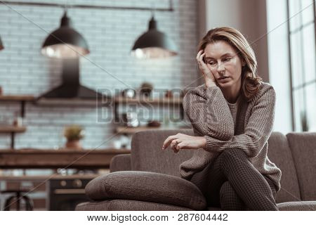 Blonde Woman Wearing Grey Sweater Feeling Sick And Depressed