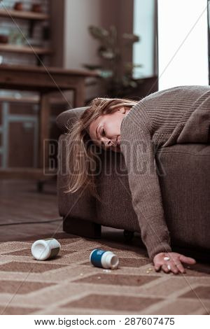 Blonde-haired Woman Committing Suicide After Taking Medication