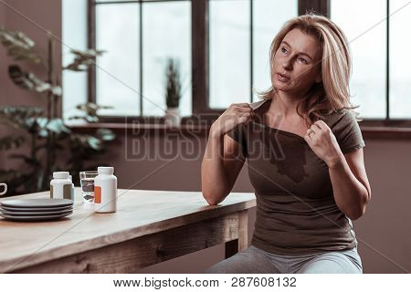 Depressed And Sick Woman Feeling Awful Suffering From Fever