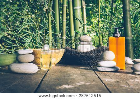 Spa Background With Woman's Hands And Clear Water On An Old Wooden Table. Japanese Style. Simplicity