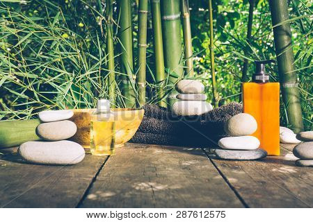 Spa Background With Woman's Hands And Clear Water On An Old Wooden Table. Japanese Style. Simplicity