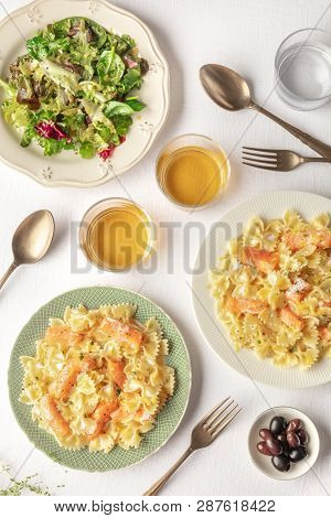 An Overhead Photo Of A Plate Of Salmon Pasta. Farfalle With Smoked Salmon And Cream Sauce, Shot From