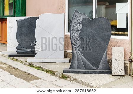 Small Private Firm Produces Tombstones And Exhibites Samples Of Its Products On The Street.