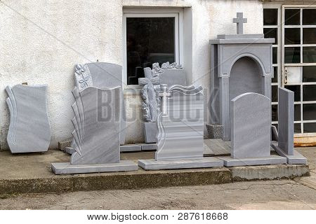 Small Private Firm Produces Tombstones And Exhibites Samples Of Its Products On The Street.
