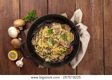 Scallopine Di Vitello, Veal Scallopini, With A Mushroom Sauce, Lemons, And Parsley, Shot From The To