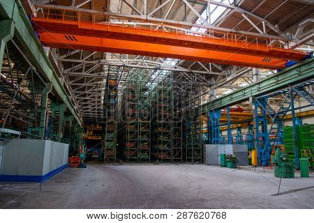 The Interior Of A Large Warehouse Of Heavy Iron Products And Metal Goods With Pallet Storage Shelves