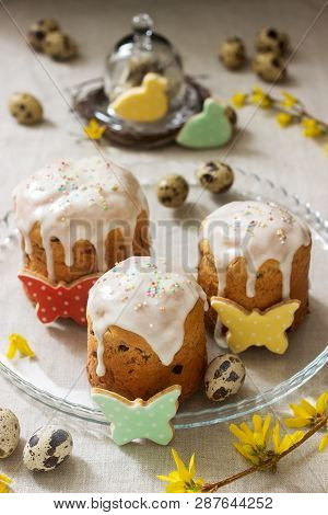 Easter Composition Of Easter Cakes, Biscuits, Eggs And Forsythia Flowers. Rustic Style.
