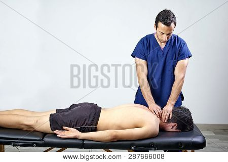 Physiotherapist Doing A Mobilization Neck Of Female Patient. Manual Therapy.  Neurological Physical