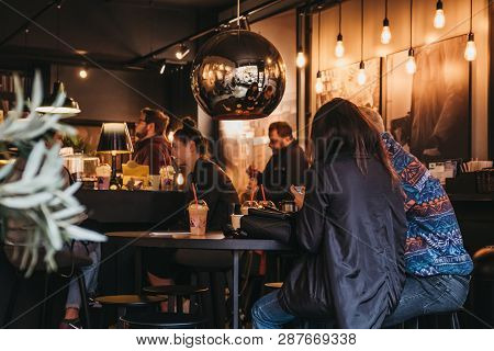 London, Uk - March 2, 2019: People Having Drinks Inside Joe And The Juice Cafe In Hampstead, An Affl