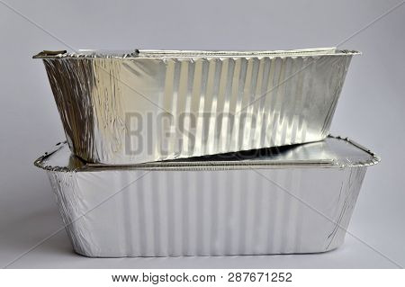 Two Disposable Foil Food Containers For Takeaway On White Background