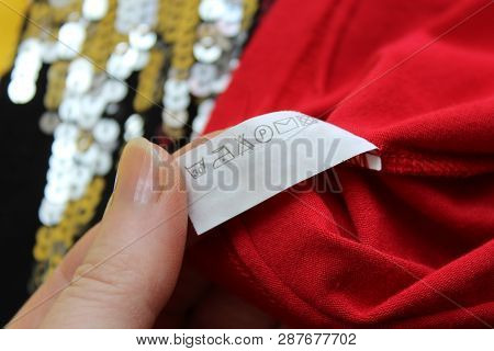 On The Seamy Side Of The Clothes There Is A Tag With Instructions For Use