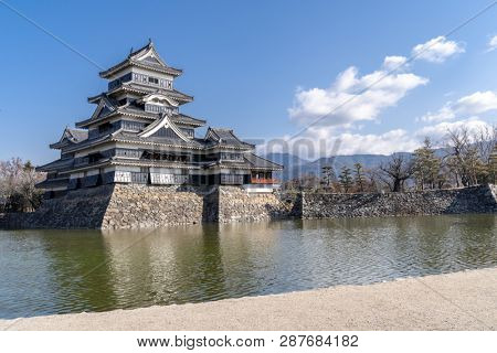 Matsumoto castle against blue sky in Matsumoto city in Nagano in Winter. Matsumoto Castle is an old historic castle in japan, its nickname is Crow Castle.
