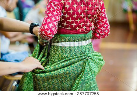 The Process Of Dressing The Thai Pantomime For The Actors With Hand Sewing, Repairing,