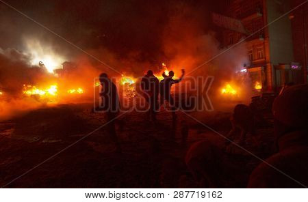 Kiev, Ukraine - January 22, 2014: Among The Flame Burning Wheels Rebel Fighters Try To Contain The O