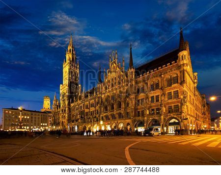 Marienplatz central square illuminated at night with New Town Hall (Neues Rathaus) - a famous tourist attraction. Munich, Germany